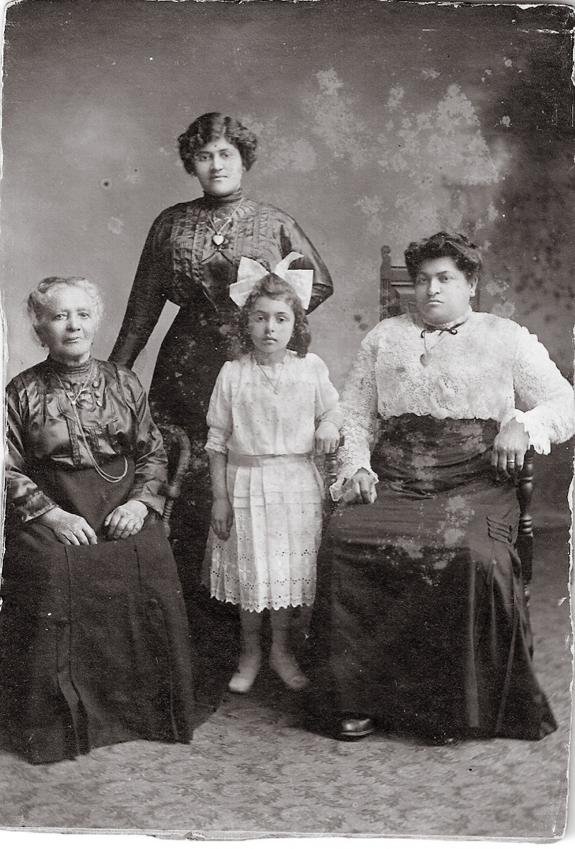 Pictured in the front center is Marie Cavolo, her mother Delia (Izzo) Cavolo behind her, and Marie's Grandmother Izzo and Great-Grandmother Izzo. Taken in Sheepshead Bay, Brooklyn, N.Y. c. 1913. View full size.