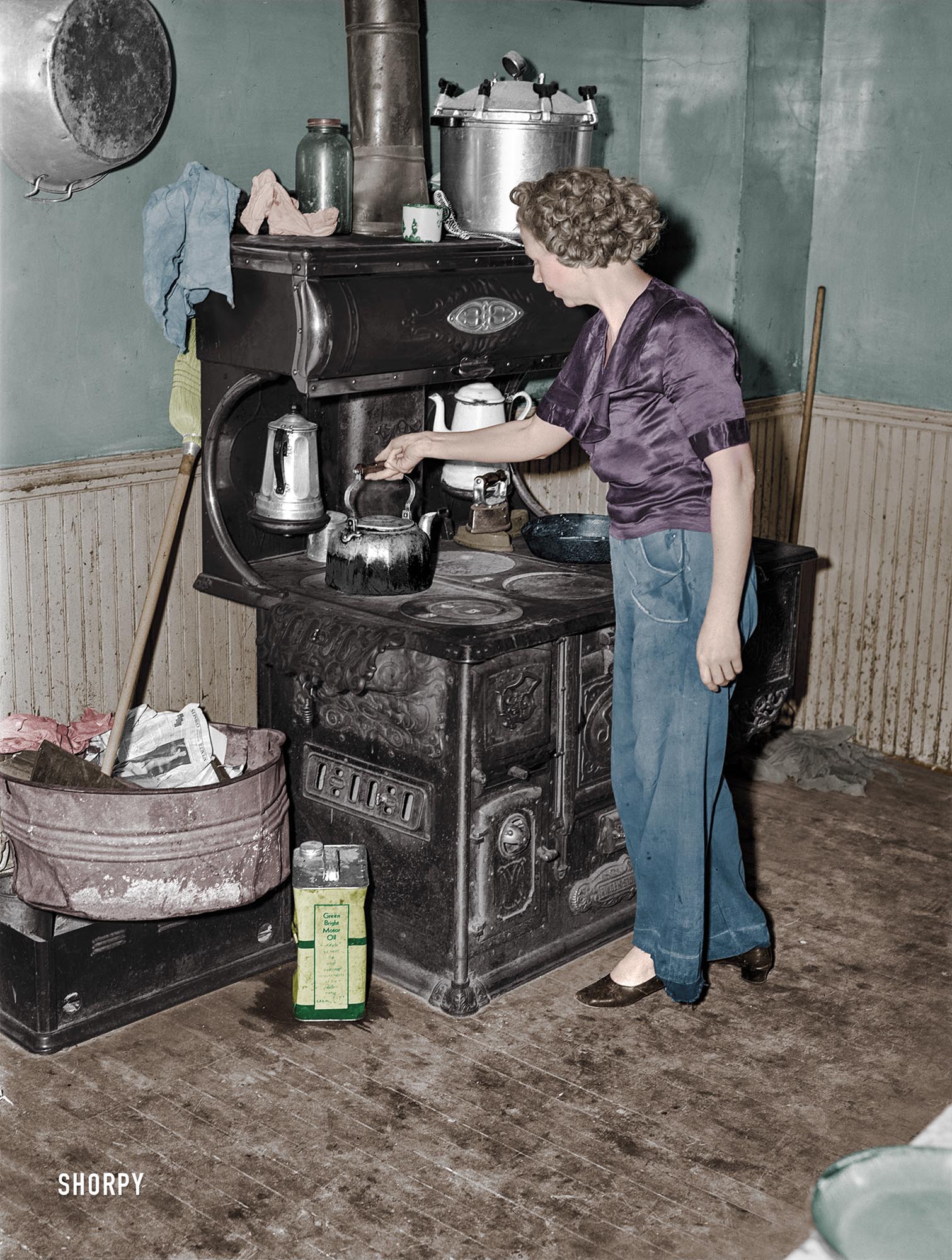 Here is my colorized version of this Shorpy Photo. This is a fire hazard. Check out the gallon oil can next to the stove, loose newspapers in the wash tub and rags on top of the stove.