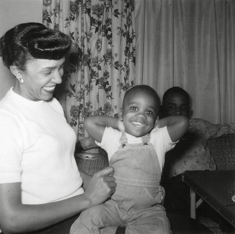 Here is a snapshot from an album I purchased at an estate sale. I believe it was taken in 1957 in Washington State. The boy looks like he's being tickled. View full size.
