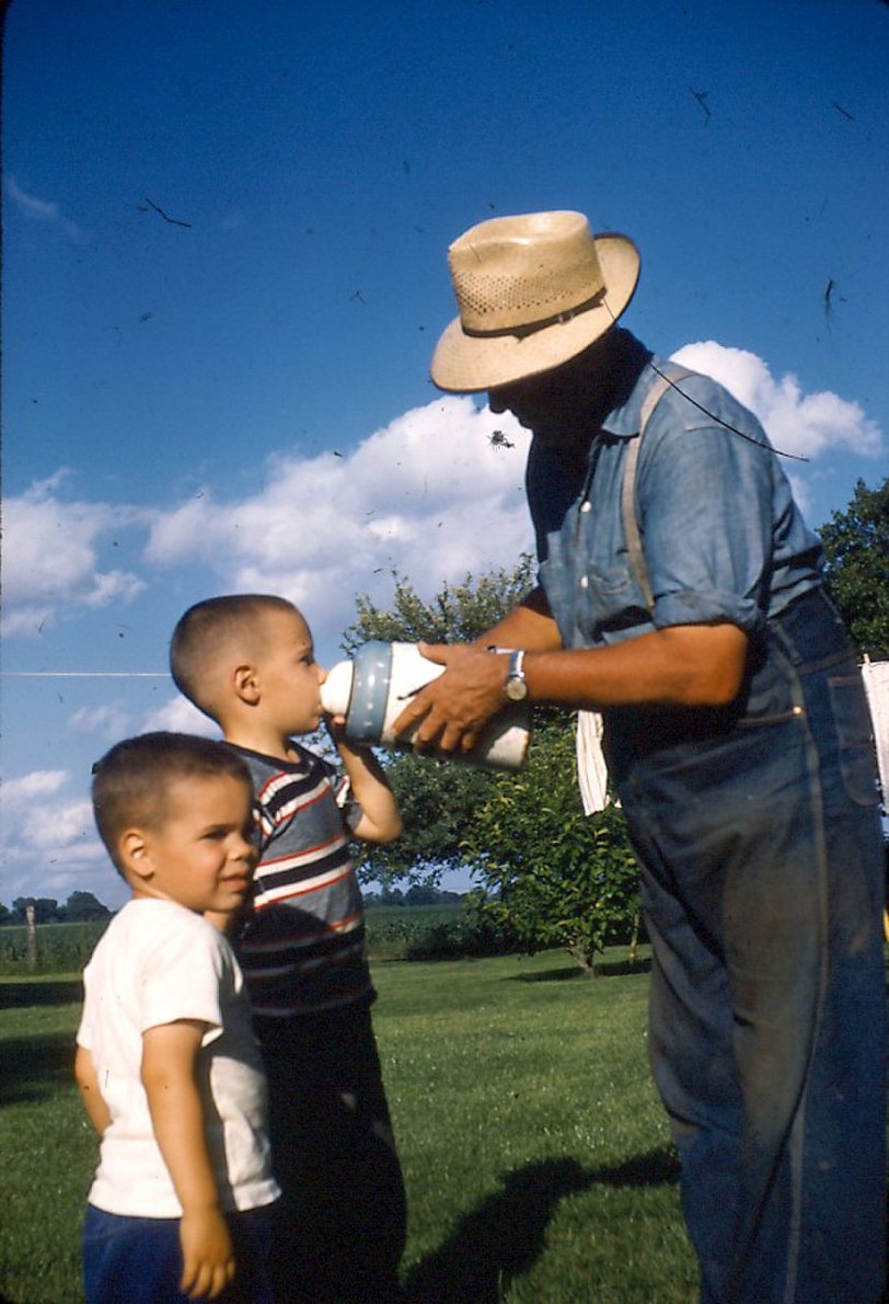 The well water had a sweet taste to it and I remember how much I loved it over the chemical taste of city water. Harry Sr., Hank (striped shirt) and George. 1957 Kodachrome slide taken near Blandinsville, Illinois. View full size.
