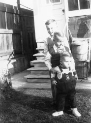 This is from my Dad's black and white prints. My older brothers and I are in the back yard of my grandparent's home on Fern Avenue in Toronto, 1952. I'm the guy in front seemingly intent on breaking loose. I had a reputation for running away from home when I was a preschooler, always ending up at a friend of the family a few blocks away. Dad resorted to putting a hook high on our wooden screen door so I wouldn't bolt.