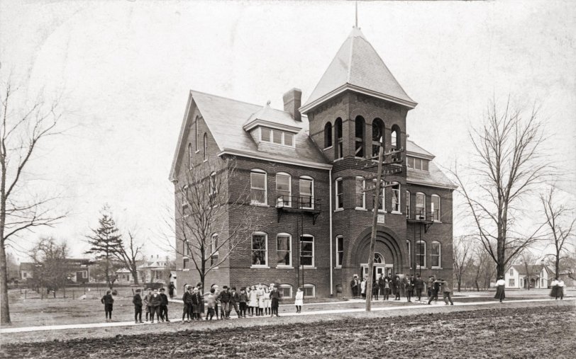 The Tremont Public School, 1910. The building serves as the grade school and highschool and is located about where the current grade school stands at 200 S. James Street. The bell from the tower is on the corner of the current grade school. The image is the property of, and used with permission of, the Tremont Museum and Historical Society at the corner of Sampson and Madison Streets in Tremont, IL. 
