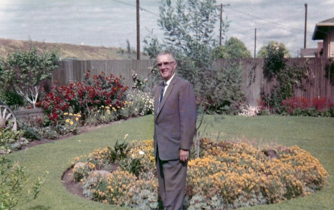 My wife's Uncle Pat O'Neill in his backyard in the River Park neighborhood of Sacramento, California, taken on July 14, 1956. He was a retired prison guard from Folsom Prison, and his only niece, my wife, was always scared of him. We live in this house now. Levee in the background is that of the American River. View full size.