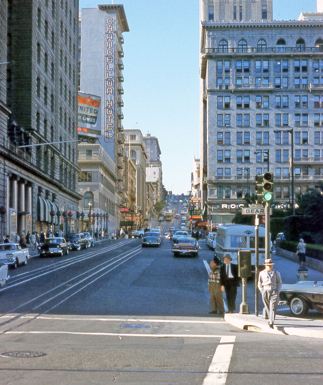 Powell at Geary, San Francisco; Union Square just off to the right. From a color slide by my father. View full size.