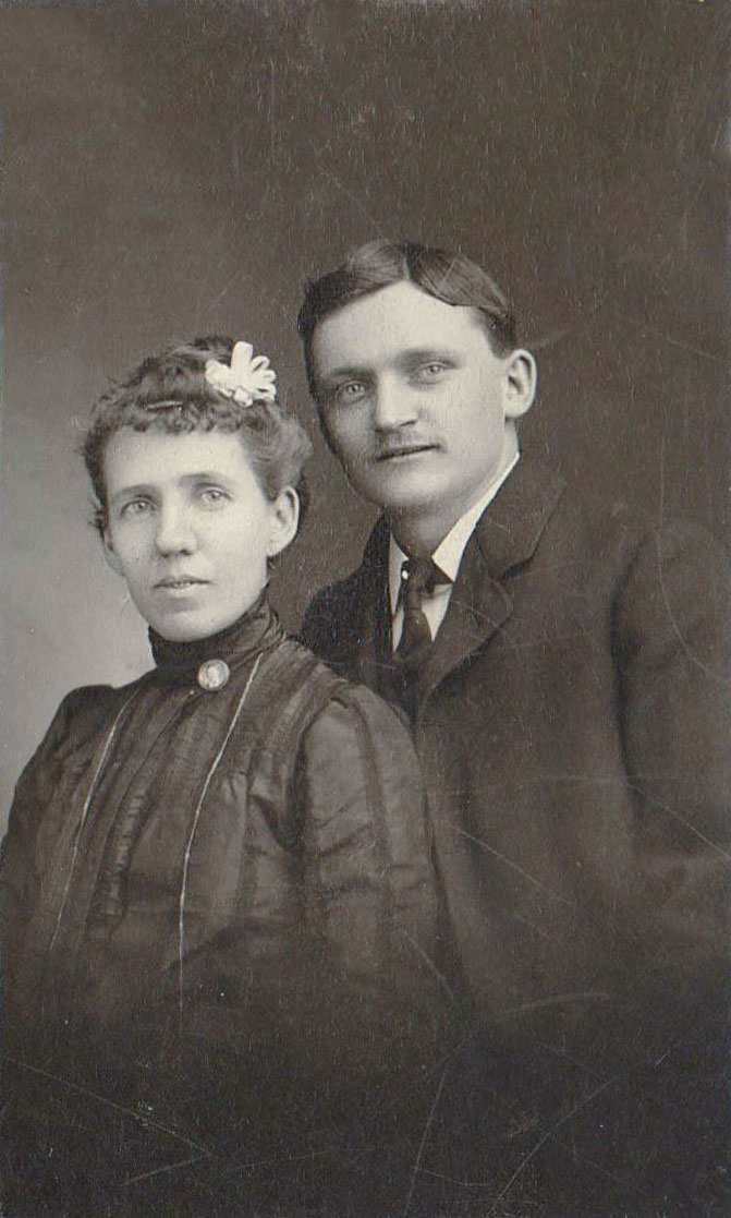 The couple in the photo is unknown, but the photographer was Paul A. Gayer of Gayer Studios in St. Louis, Mo. Gayer had many locations, but according to the card, his studio was at 22nd &amp; St. Louis Ave at the time of this photo; this means the photo was taken between 1905 and 1915.

