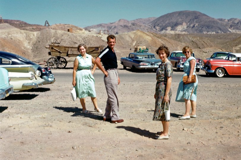 Taking a quick pit stop, trying not to waste anytime on the way to Vegas. Woodrow and three ladies. Kodachrome slide. View full size.
