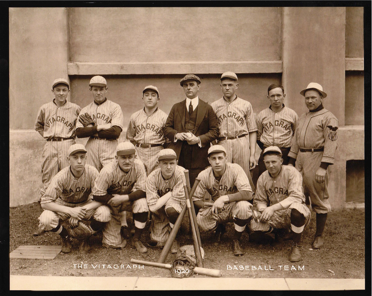 The Vitagraph Studios baseball team, posing for the annual picture. My grandfather was the catcher (rear, third from left). I believe the location was Midwood Field in Brooklyn. View full size.