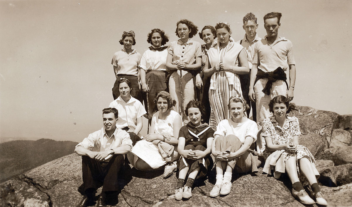 Taken in 1937, this is labeled Wesley Foundation of Grace Methodist Church, Keene, N.H. on Mt. Monadnock. My mother is the first girl seated on the left. This was the year she graduated from high school. View full size.