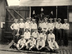 Another photo from my grandfather, this one taken in Clatskanie, Oregon, on July 4th, 1905. He'd helped to organize the volunteer fire department in this little logging town, and here they all are, dressed up for the Independence Day parade. My Aunt Hazel is seated on the box of the decorated hose wagon, dressed as a water sprite. My grandfather is in the back to her right, wearing a moustache and a white fedora. Aunt Hazel wrote on the back of this photo: "I was making such a mean face because I didn't want my baby sister Hannah in the photo with me." View full size.
(ShorpyBlog, Member Gallery)