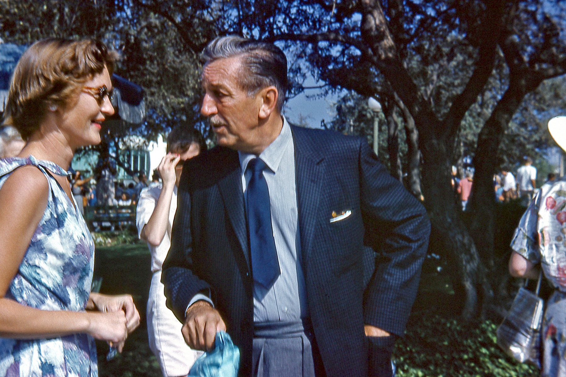 Disneyland, September, 1959. My mom in a close encounter with Walt Disney. When she asked him for an autograph, he politely declined, saying that she could write to his office for one. This seems consistent with what I heard many years ago, that he didn't like to spontaneously hand out autographs because his authentic signature wasn't quite like the official Disney logo. You can just make out the House of the Future in the background between them. View full size.