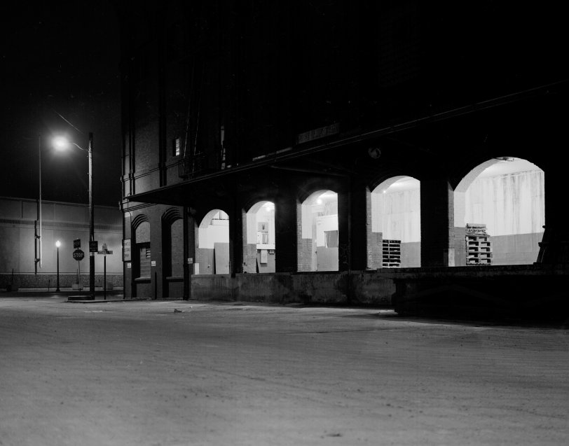 Photo taken about 2 AM sometime in early 1973 at corner of Lombard and Battery Streets along San Francisco's Embarcadero. Camera: 4x5 Speed Graphic. The brick building with loading dock still exists. At the time it was a cold storage warehouse, but has since been remodeled into high-end offices. View full size.

