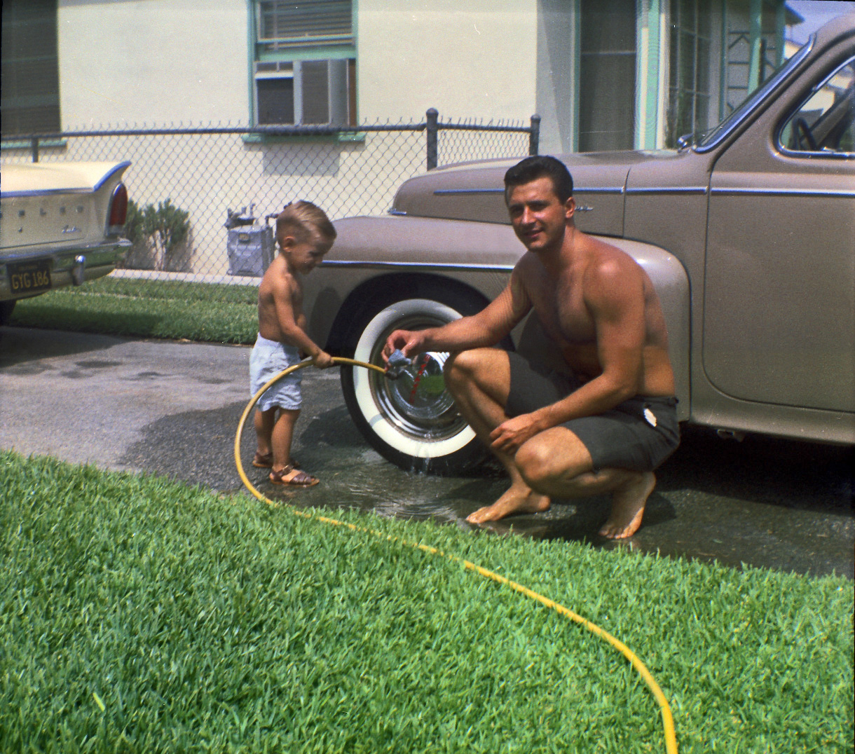 This is my dad as a toddler with Grandpa washing the car, probably around 1963 in Los Angeles. Scanned from a Kodak safety negative. View full size.