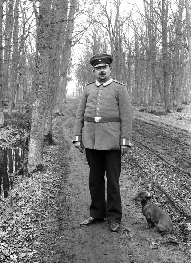 A German soldier wearing his parade uniform with his Dachshund. The Kaiser helped set the trend for making Dachshunds fashionable. Scanned from the original German 10x15cm glass negative. View full size.
