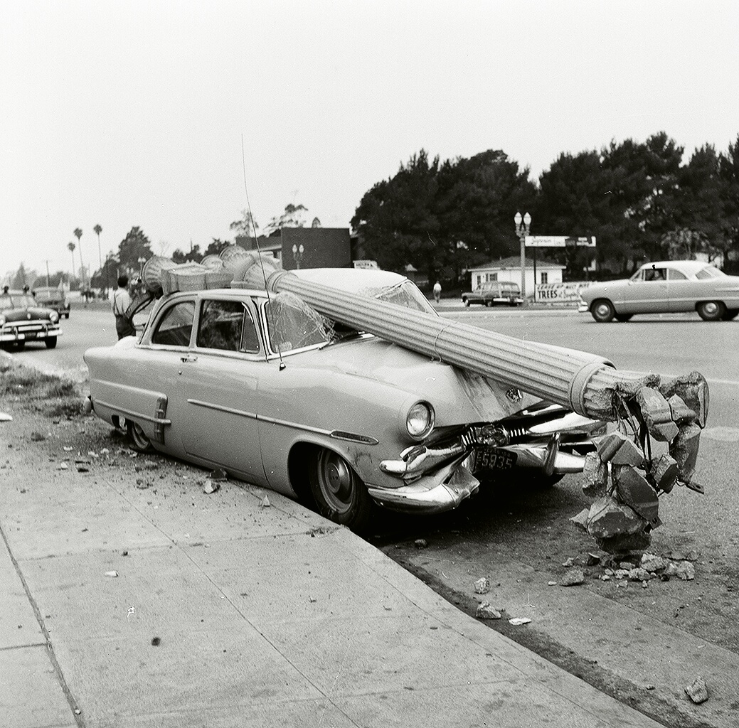 Ford meets lamppost in West Los Angeles on San Vicente Boulevard in the 1950s. Obviously a hard-hat area. View full size.