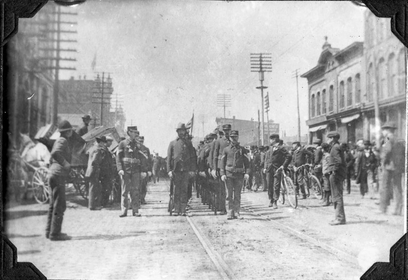Leaving for the Spanish-American War, downtown Peoria, IL (1898).
Original photos taken by William A. Gregory who lived on North Sheridan in Peoria. William worked for Frank D. Murray, a Peoria contractor (1881-1957) who built 100+ houses, including a good number on Frye Ave. William A. Gregory was an amateur photographer, picking up the hobby early on, taking thousands of architectural and event pictures of Peoria.
