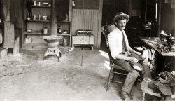 Photo was taken in 1929 in Wolf's tailor shop and apartment in Erie, Pennsylvania. He lived in the back of his shop - you can see his meager cooking  utensils and a Victrola on the dresser behind him. His family was in Brooklyn, New York. More here.
 View full size.
(ShorpyBlog, Member Gallery)