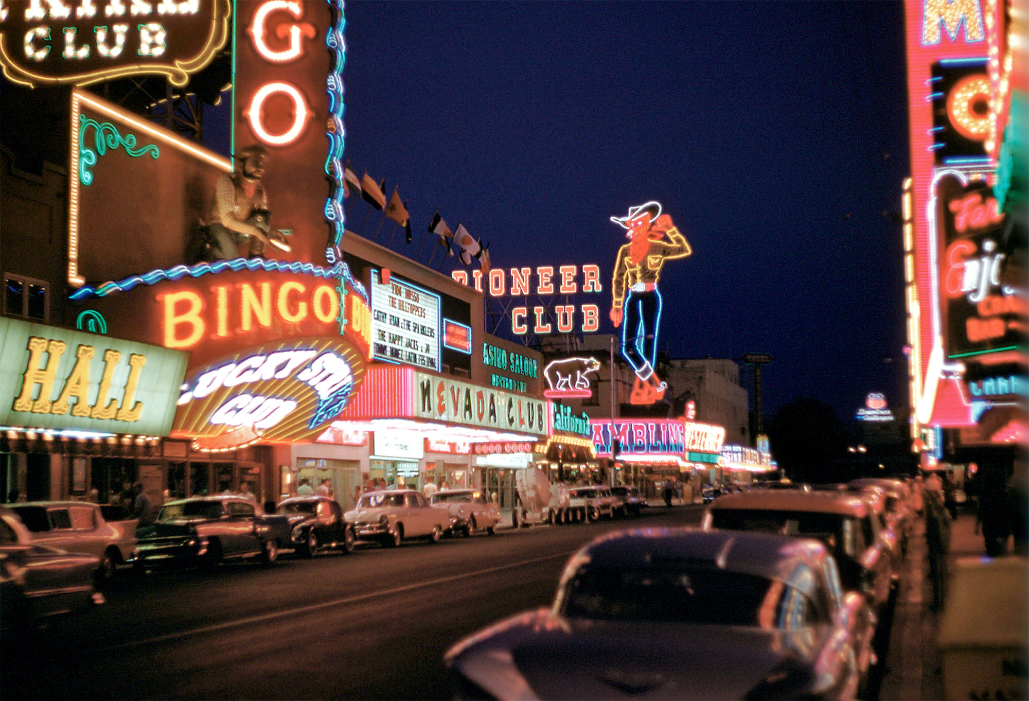Classic Las Vegas -- Fremont Street. 35mm Kodachrome film taken by my father-in-law, Woodrow Humphries. I'm guessing 1958 or so. The Westerner was open from 1950 to 1962. The Mint and The Boulder Club (with its famous sign) are on the right edge. The marquee above the Nevada Club was a late-'50s addition. Any other thoughts are welcome. I just noticed the VW Beetle! View full size.