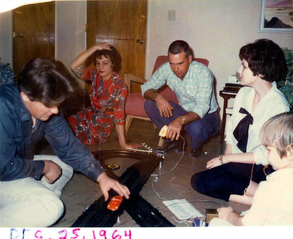 This photo is mine, Christmas Day 1964, the best Christmas I ever had! The people are L-R my Uncle (Mom's bro), Mom, Uncle (Mom's sis's hubby), Aunt (Mom's sis) and me, age 5. The slot car is an Eldon Selectronic set, I still have some of the track. View full size.
