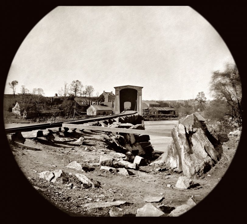 Original here. Belle Isle: 1865: Spring 1865. Belle Isle railroad bridge from the south bank of the James River after the fall of Richmond. Glass plate negative from the Civil War collection compiled by Hirst D. Milhollen and Donald H. Mugridge. Restored by Callie Jayne. View full size.
