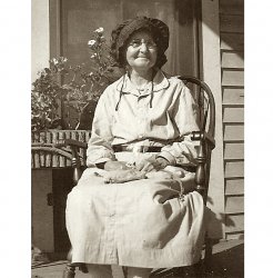 Amanda Farrow Bruce 1930. Hard to see her clay pipe, but tobacco pouch is visible in her lap.