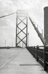 Early picture of the Ambassador Bridge that links Detroit Michigan and Windsor Ontario. Bridge was built in 1929 and this looks like it was taken not too much longer after that. Note on the right side the sidewalk and people walking on it, this was closed a long time ago as it was not part of the bridge's charter (at least what I have read). From my negatives collection. View full size.
Made the walkI walked across this bridge in the late 60's with my Boy Scout troop. Not sure if there was an International scouts day, or something like that. We made the walk and met up with a troop from Windsor.  
(ShorpyBlog, Member Gallery)