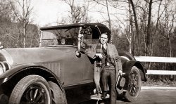 The recent photos of the alcohol testing going on during Prohibition reminded me of this photo of my grandfather, Arnold McGuire. According to family lore, he supported himself during Prohibition by running liquor from Montreal (where they lived) to Chicago. His auto, shown here, was one of only a few made of this model, but its details have been lost to time. Maybe some of the car enthusiasts out there would be able to tell more about it. It allegedly included special hidden compartments for the liquor. View full size.
Spare TanksI was told my grandfather purchased a used Model T in the mid '20s that had an "aftermarket" tank under the seat, no doubt for the same purpose. This was in Alabama.
Rum Runner CarThe car in the picture was made by Stephens Motor Works  in Freeport, Illinois. The step on the unique to Stephens as is the round opera window on the top. The Stephens has the Salient 6 motor, which reached speeds of around 60 mph. I have three Stephens cars and I have parts of a Stephens  that was also used as a rum runner. 
[Another Stephens can be seen here. -Dave]
(ShorpyBlog, Member Gallery)