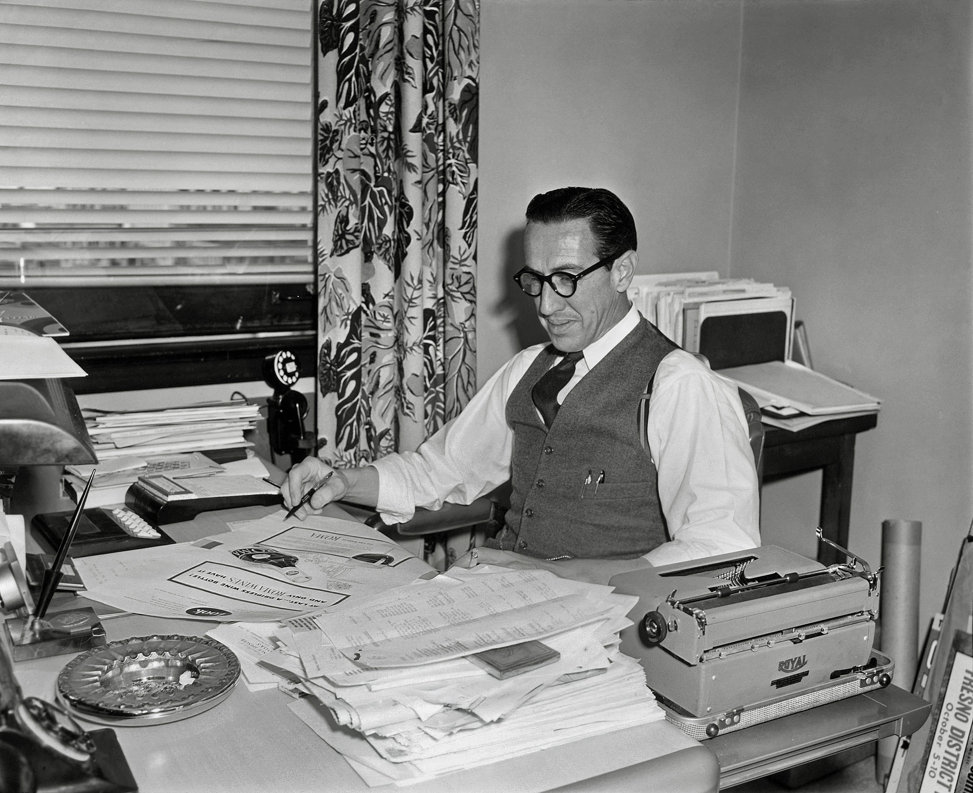 Back to my Uncle Albert in his office at the Foote, Cone and Belding advertising agency in San Francisco's Russ Building about 1954. Amid a fine selection of period office accouterments, including a space-saver phone and cigarette ashes, he's working on this ad. As Vice-President and Production Manager, he was in charge of layout, design, graphics and typography, and also for such accounts as Southern Pacific, Dole Pineapple and Pacific Bell.

Albert's interest in fine printing and typography led to his amassing a significant collection of manuscripts, first editions, prints and other art, much of which now resides at institutions like Stanford, UCLA and Berkeley. In particular, his collection of over 1000 books, drawings, etchings and correspondence of the English sculptor, printmaker and typeface designer (as in Gill Sans) Eric Gill is at the Gleeson Library of the University of San Francisco. View full size.