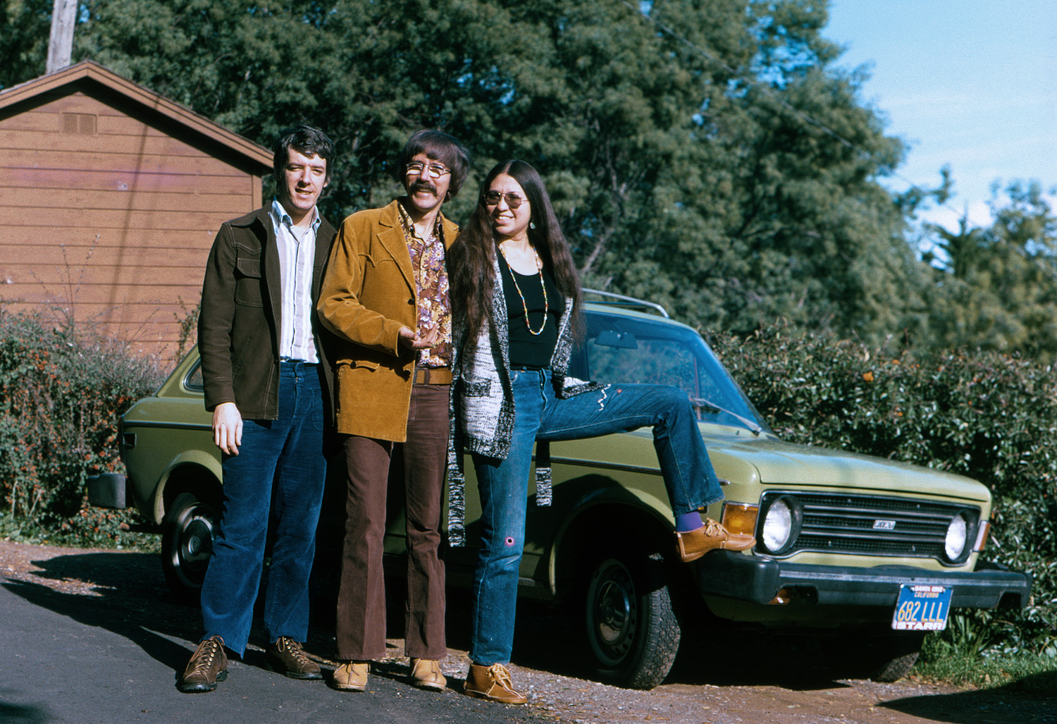 Another mirth-provoking look at the clothing, footwear and vehicle choices of the 70s, just a bit down the street from a similar scene three years earlier. This time, in January 1974, I join my brother and sister-in-law in a pose by their now different green foreign car, a Fiat station wagon. I'll leave it up to the chorus of commenters as to whether the various changes overall represent progress or regression. I'll only say that once again, my sister-in-law is the most stylish. Kodachrome 64 slide from my brother's camera. View full size.