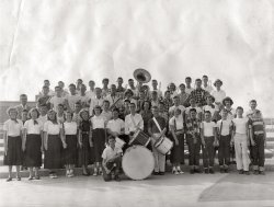 Judging by the age of the kids, I am guessing this is a jr. high band, mid 1950's. The fellow 3rd from the right front row I am certain is my father Gary. The only thing that baffles me is that my dad NEVER mentioned anything about playing any kind of musical instrument, nor did he ever play any musical instruments while I was growing up. Wish he was around for me to ask him. View full size.