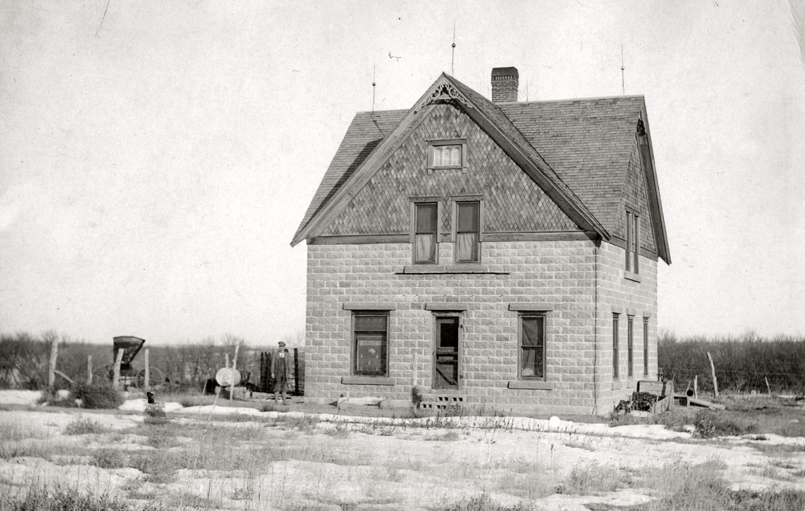 An ancestor's farmhouse under construction circa 1900 (note front steps missing). Built with site-molded concrete blocks that simulate rough -faced stone, the house was destroyed by a tornado circa 1970. The concrete blocks were reused to build a barn that still stands. View full size.