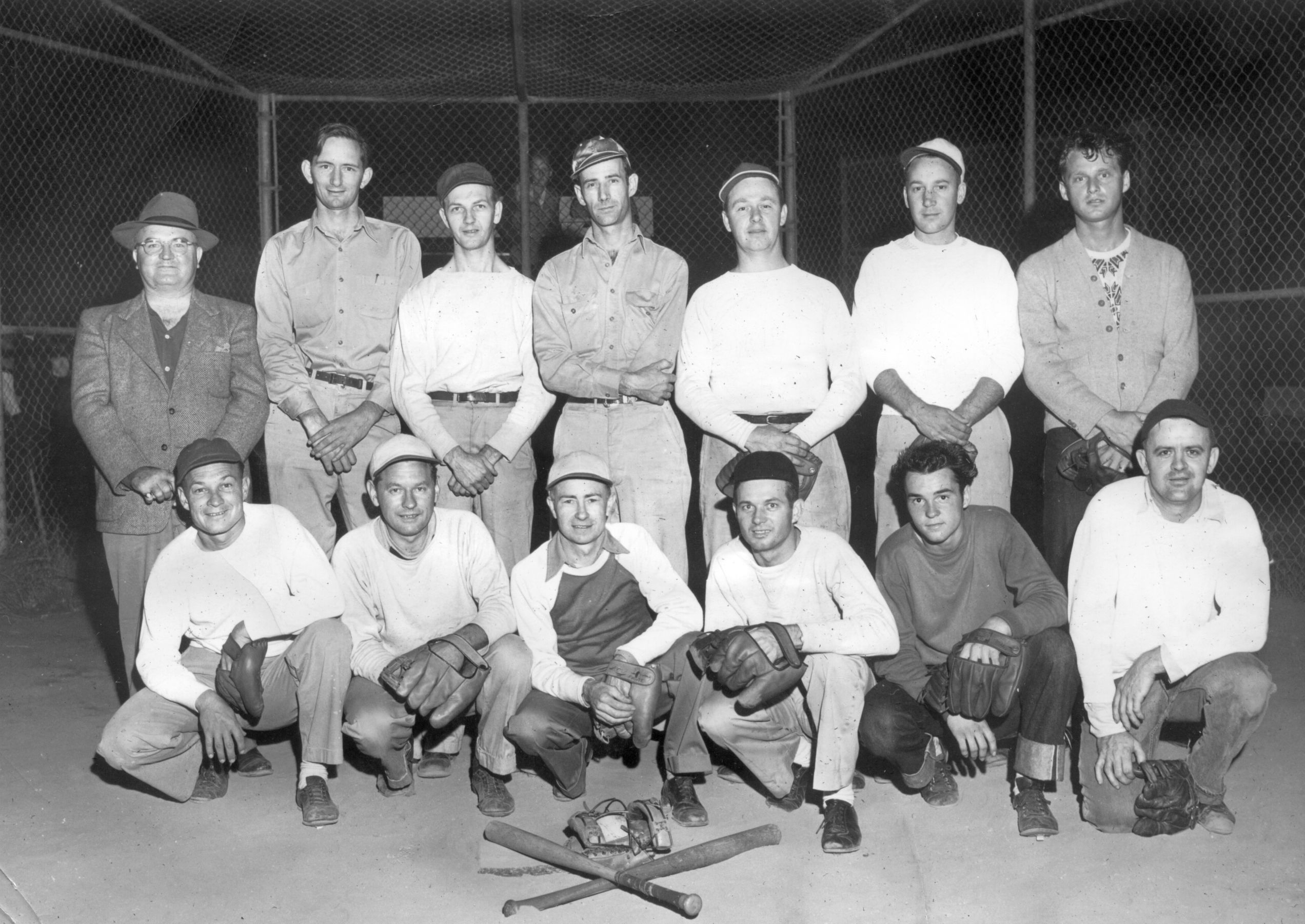 Another baseball team my grandpa played with during the 1940's. He is 2nd from left on the bottom row. The guy to his right is also in the other baseball team picture. View full size.