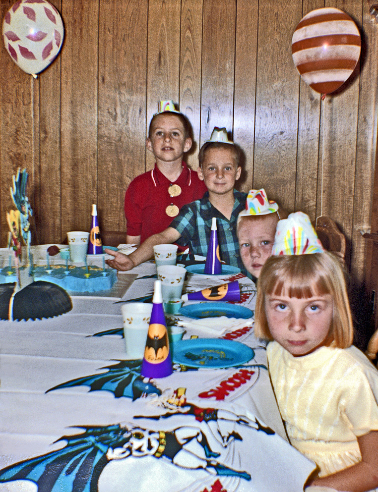 Holy Dixie Cup, Batman! It's my nephew Jimmy's (in red shirt) seventh birthday Bat-party. Swoosh! There are four more gleeful Bat-celebrants on the other side of the Bat-table here in the suburban Batcave secretly located in Diamond Bar, California. Bat-scanned from the KodaBat-color Bat-negative shot by my Bat-sister. View full size.