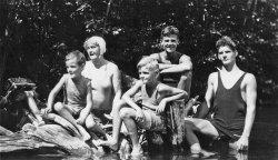 Gloucester Pool, Ontario near Port Severn, at a family cottage, circa 1930. My grandmother and her four sons. My father, Doug, is front and centre. View full size.
Outboard MotorThe outboard motor on the boat at the left appears to be a Lockwood Silent Chief similar to the one in this ad on Ebay. It's such a different look compared to modern outboards. I wonder how silent it was.
(ShorpyBlog, Member Gallery)