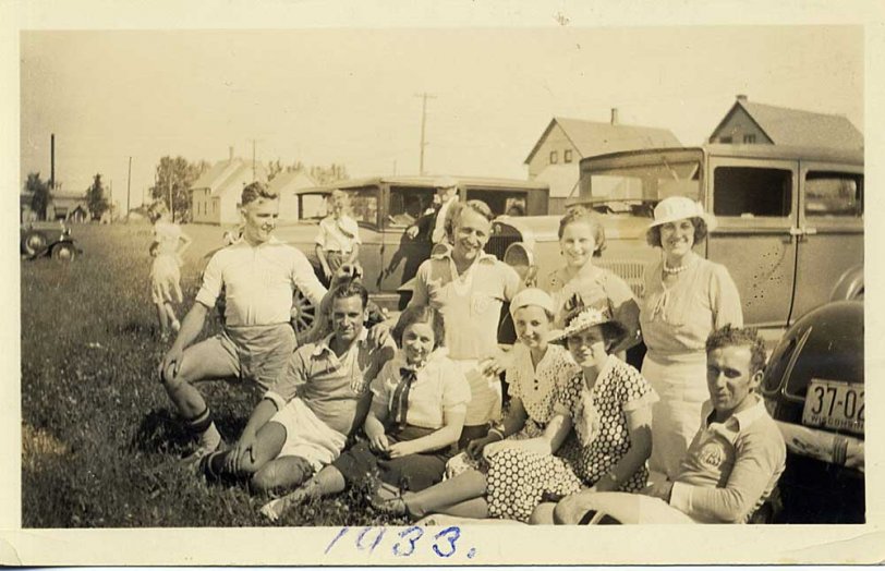 Grandma (in the polka-dot dress) and Grandpa Poeschl (sitting next to her) in 1933 after a Bavarian Soccer Club game, Milwaukee WI.  Grandpa was a longtime player for the Bavarians (he had the cinder remnants in his knees to prove it) and was inducted into the WASA Hall of Fame in 1985.  Am assuming from the photo, that their team won the game that afternoon - either that or they were a happy bunch of sore losers. View full size.
