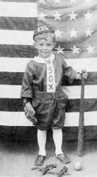 Picture found among my mother's photos. Presumably a relative, but not identified. Photo probably made in Brooklyn circa 1910. View full size.
Poor KidWhy is this boy smiling? He must not realize he's a southpaw doomed to live in a right-handed world. I hope he is in a better place today.
(ShorpyBlog, Member Gallery, Kids)