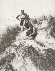The same three women previously seen on the beach, gather on the dunes with rubber swim caps and bathing suits. The place is probably Lithuania. The date is some time in the 1920s. My best guess at who these people are, is my grandmother’s two older sisters and her mother (center). That would have made them my mother’s aunts and grandmother. Because they lived in Vilna (now named Vilnius) and my mother lived in Brooklyn, New York, she and these relatives never met.
(ShorpyBlog, Member Gallery)