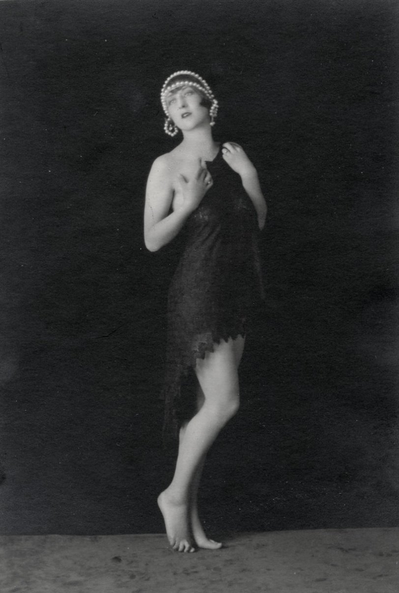 This is a picture of my  mother taken sometime in the 1920s during the time she was a professional dancer.  She worked out of San Francisco. View full size.

