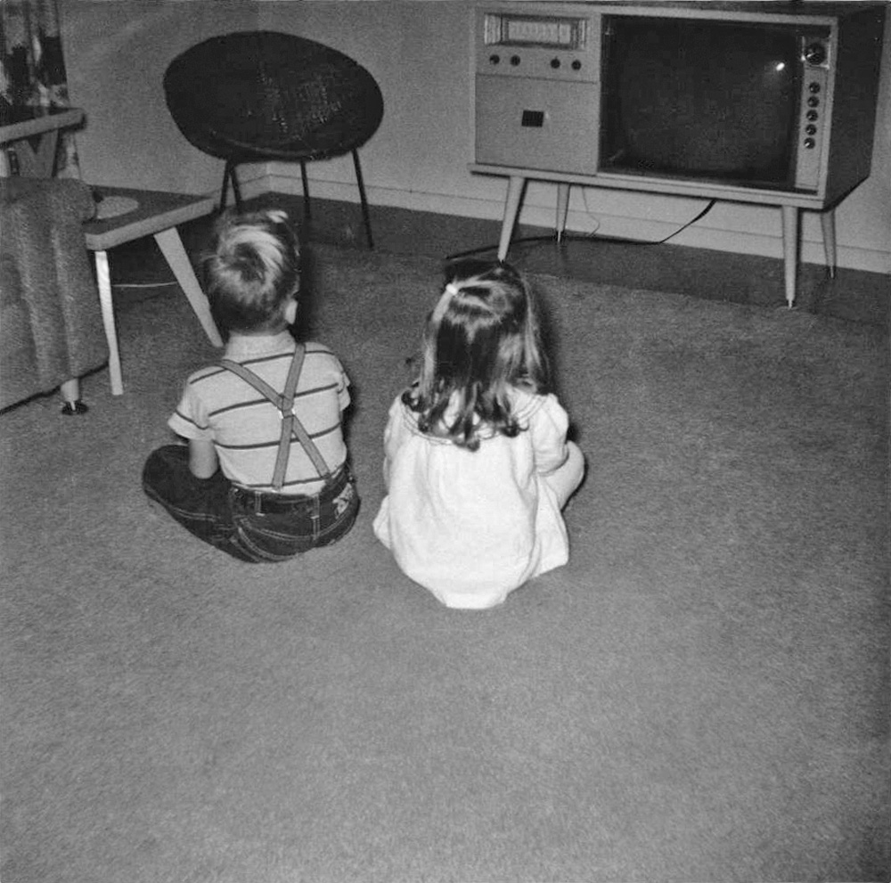 A classic view of my siblings, Becky and Frank, and their favorite pastime. View full size.