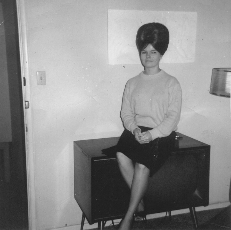 My Aunt Susan December 1963. She had to stay away from low flying aircraft and short doorways. View full size.
