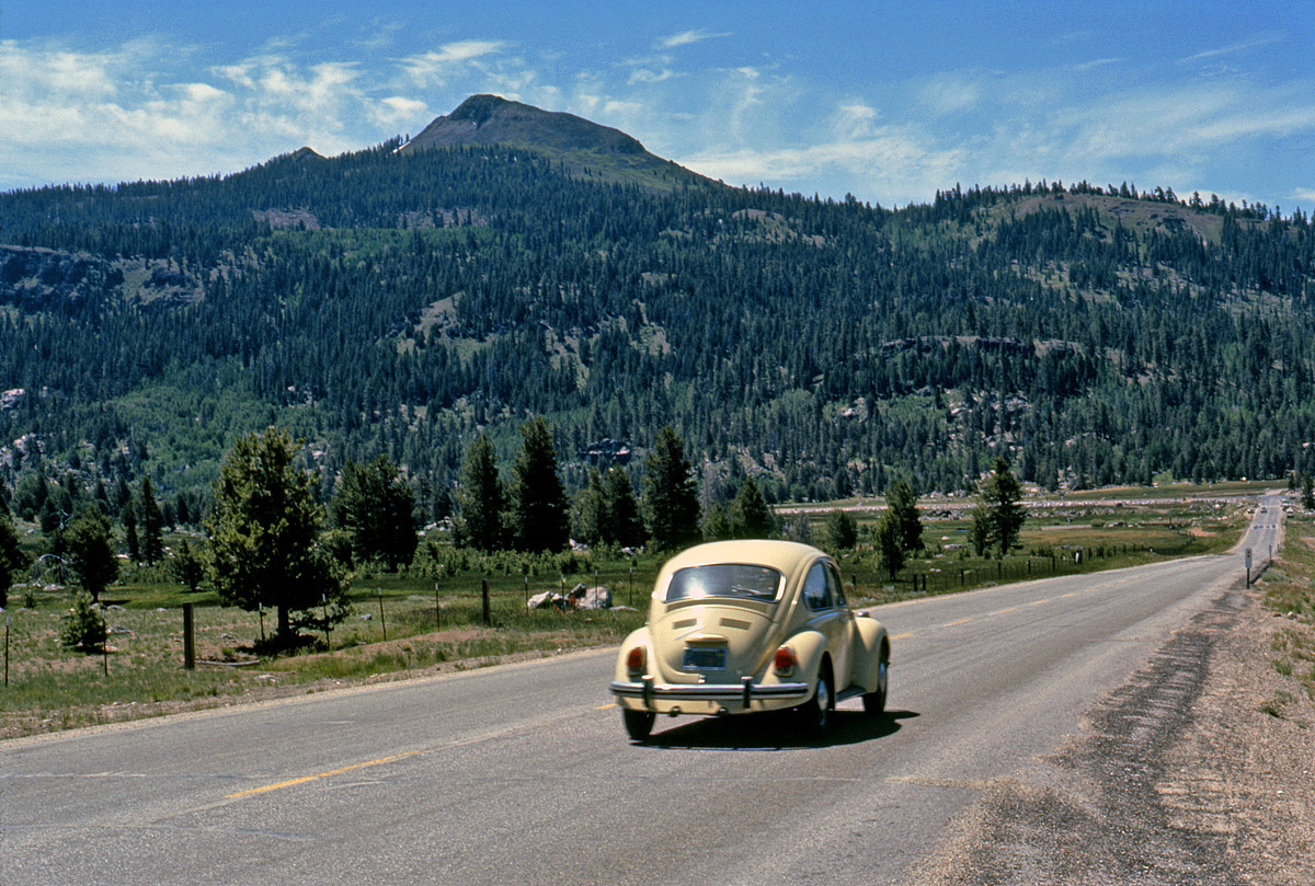 Good to see Tony W. back. His shot of the Mustang at Zion inspired me to haul out this one I took a year later, June 1972, near Lake Tahoe. Those were the days when, if a car happened to zip by as you were taking a shot, the chances of it being a VW Beetle were whole orders of magnitude greater than today. It's one of the interesting time-capsule details you notice in films of that period that have a lot of location filming, like on the streets of San Francisco in Bullitt or Dirty Harry; the sheer quantity of those things. Ektachrome slide. UPDATE May 2016: I've finally found out where this is: the VW is on California State Highway 89 approaching the intersection of State Highway 88 in the Hope Valley area south of Lake Tahoe. View full size.