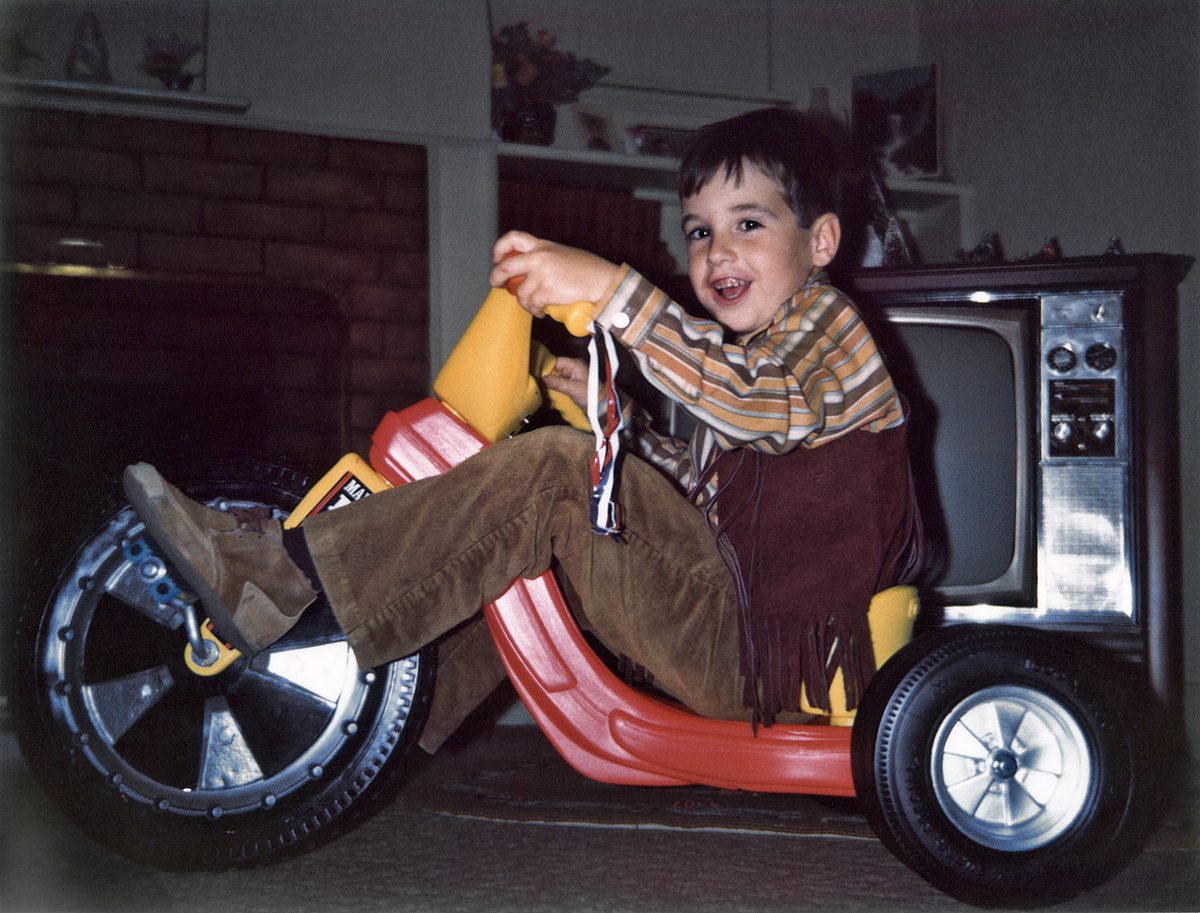 December 24, 1971. My nephew Dave, age 6, on his just-unwrapped and assembled Big Wheels. He uses this for his Facebook profile pic now. A Polaroid by yours truly. View full size.
