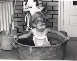 This is my lovely wife at age two enjoying a moment in the 1947 version of a Cincinnati hot tub. It may not be as aesthetically pleasing as a 2010 version but to a kid who was a member of a post war working class family, it was quite a treat to have a splash in that old tub. View full size.
(ShorpyBlog, Member Gallery)