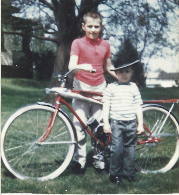  My older brother Jon proudly showing off his Sears Spaceliner bicycle he got for Christmas 1965. A little research I did shows that bike was $39.88 new (About $289 today).  The "engine" in the middle was an aftermarket battery operated piece that made cool motorcycle sounds.

 As for me, I'm not sure what's going on with that hat, it looks as if I have cowboy boots on, but I seem to be "unarmed"!