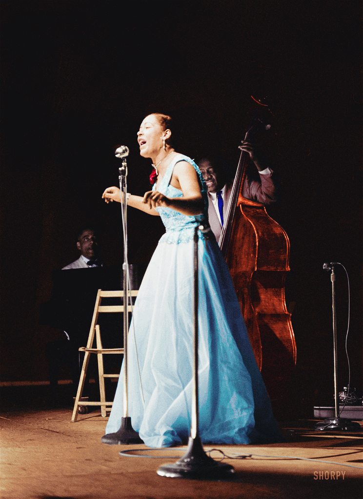 The great Billie Holiday, colorized from this Shorpy original. View full size.
