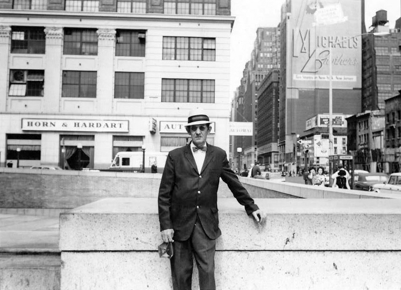 This is my grandfather, John J. Hennessy, also known as Black Jack.  He's photographed just to the side of the GPO in New York City, probably in the late 50's or early 60's, note the Horn and Hardart Automat just behind him. He was quite the dapper figure, and this photo was likely taken by his partner in crime Dinny Lambert.  They were both from Arklow in Co. Wicklow, Ireland, but had settled on the west side, what is now known as Chelsea, in Manhattan.  This photo has generated many stories about Grandpa, and his banjo hat, seen in the photo, not to mention his pretty fantastic dress sense.  We also have some amazing photos he took of his work on the subways he helped to build.  I'll dig them out next. View full size.