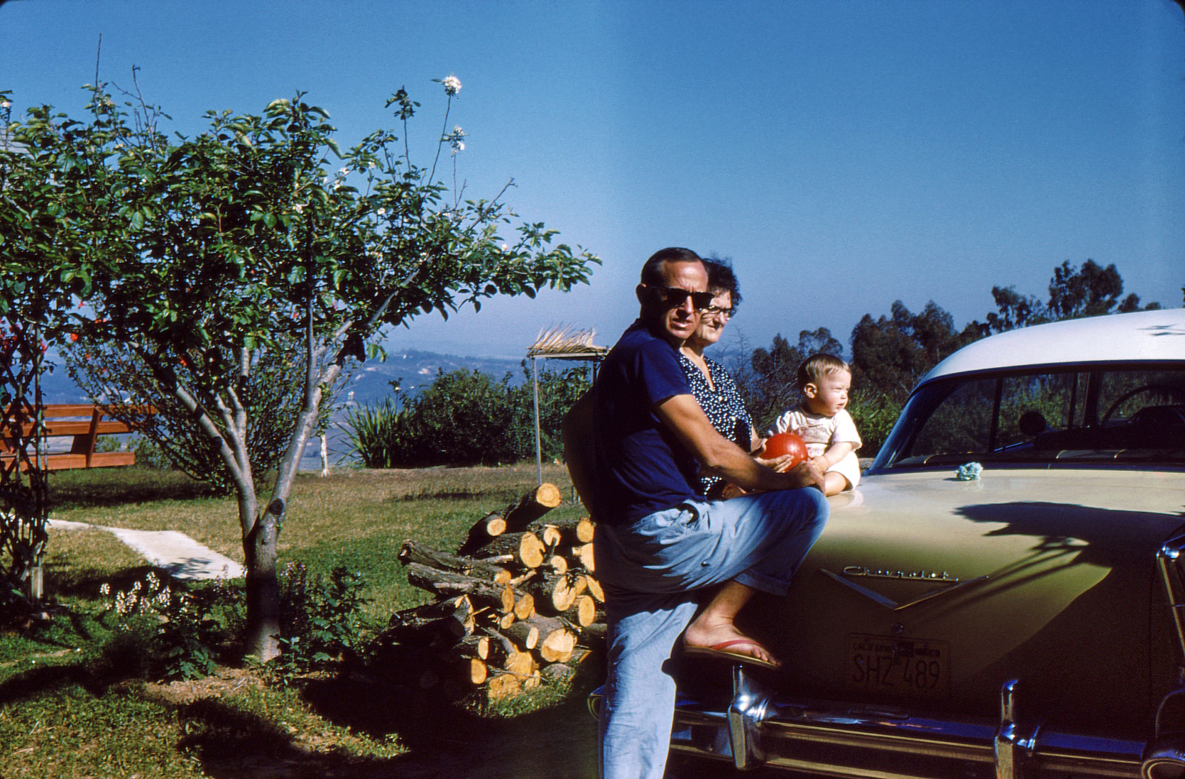 The man who looks like he's ready to hunt a giant shark is Bob Beach. Behind him is Bob's son, Rob, and next to Rob is his grandma. Taken on Crest Drive in Cardiff, California, June 1960. 35mm Kodachrome slide. View full size