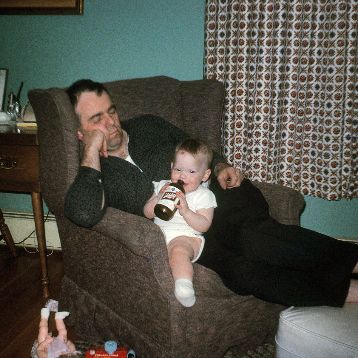 Remember the baby in Apple of His Eye? Here she is again, seemingly about to ingest something not quite so healthy, this time courtesy her dad. Another one of my friend's family photos that I'm scanning for her, posted with her permission. Again a 126 Instamatic Kodachrome slide. View full size.