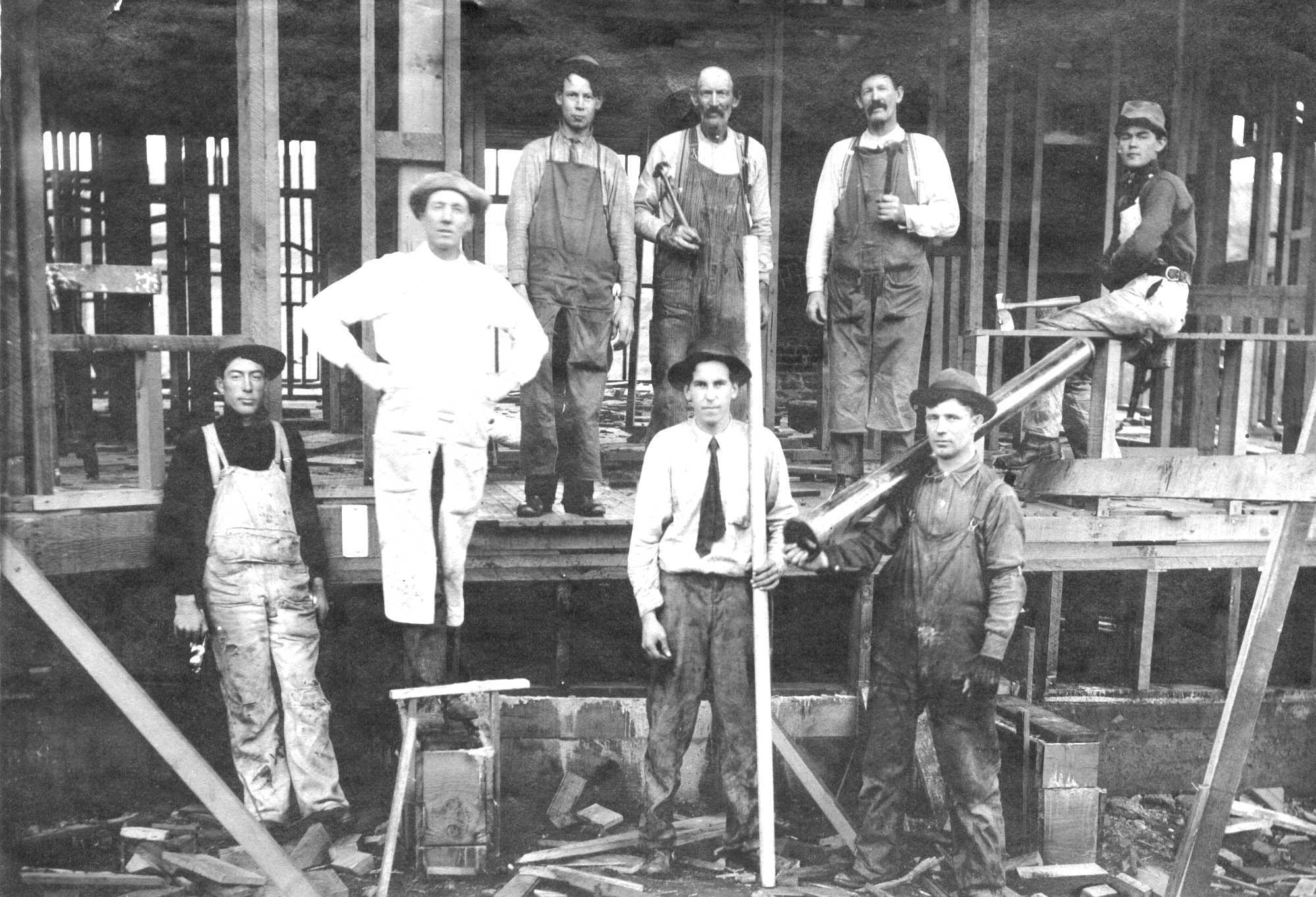 The Bowers Brothers, Tuppers, and others building a house in Wisconsin, circa 1906. Notice the ties.