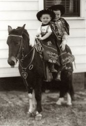 I am in the front and my brother behind me, on a long-suffering photo pony, in Gulfport, Mississippi, circa 1952. Actually, I have always been a Gene Autry fan. View full size.
HoppyNice Hopalong Cassidy setup! This is a wonderful picture. Thanks for sharing! Gene Autry fan here, too. I keep hoping one of these days Shorpy will come across some old photos of the cowboy stars of that era.
(ShorpyBlog, Member Gallery, Kids)