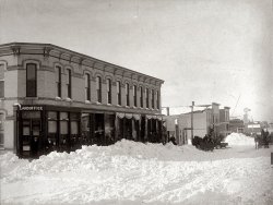 We found this picture in the attic of our 125 year old home in Britt, Iowa. As close as we can figure out, this was taken in early 1888. This picture is looking northwest in the middle of Center Street and Main Street. The right half of this building still stands today. There was a fire in the left part in 1917 and a new bank was built in its place. The upper floor of the original building was a dance studio. Britt became an official city in 1888, so I would presume that the picture was taken for the opening of the new Citizens Bank that only lasted for about 6 months. Brrrrr...lots of snow. Also, I see no telephone lines. 